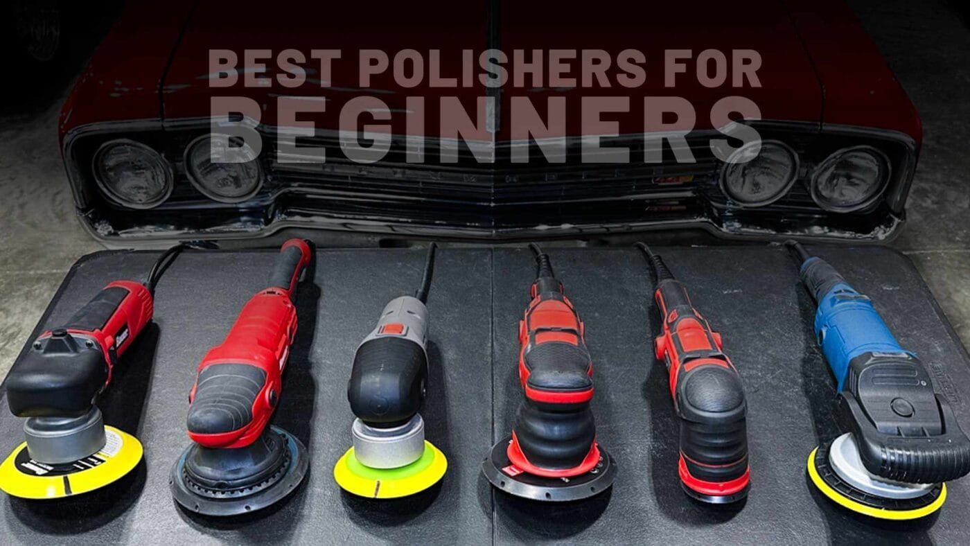 Cordless car polisher sitting on a clean white car hood in a bright garage.