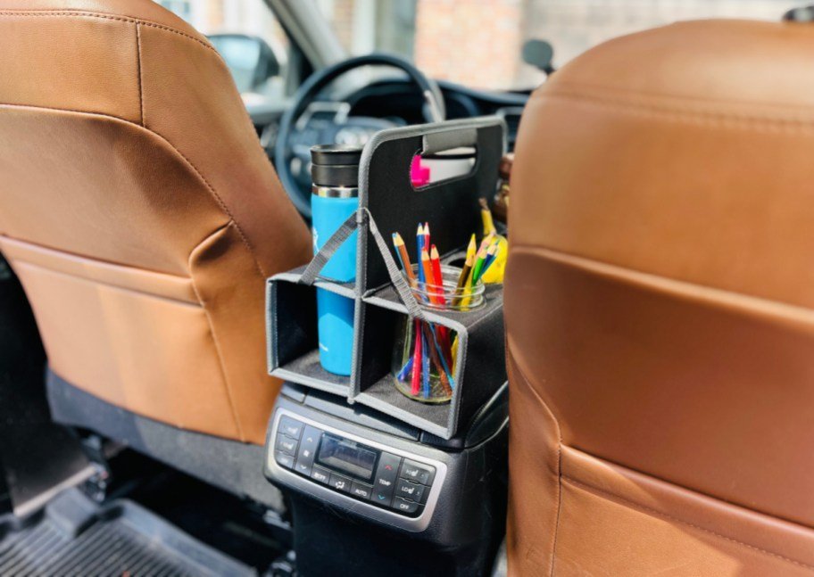 Organized car seat storage solution keeps family essentials within easy reach during travel.
