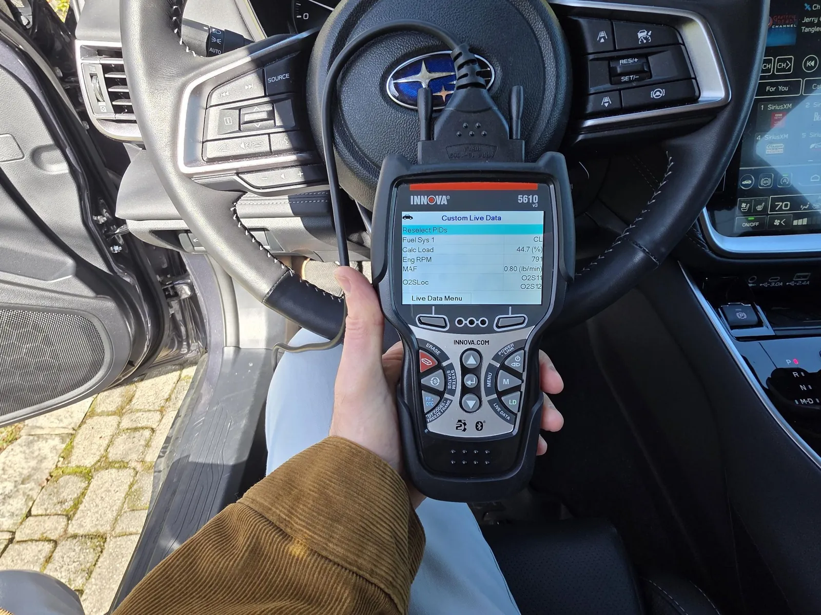 Smartphones and OBD2 adapters illustrating compatibility choices.