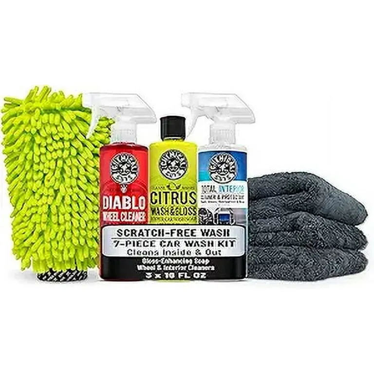 Starter car detailing kit with cleaning liquids and soft cloths in box.