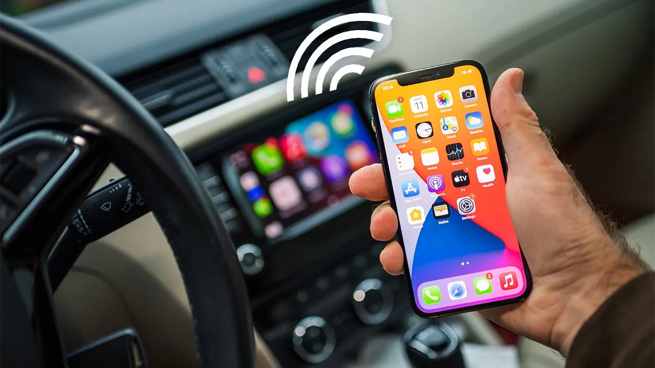 Three different wireless carplay adapters lined up on a leather armrest.